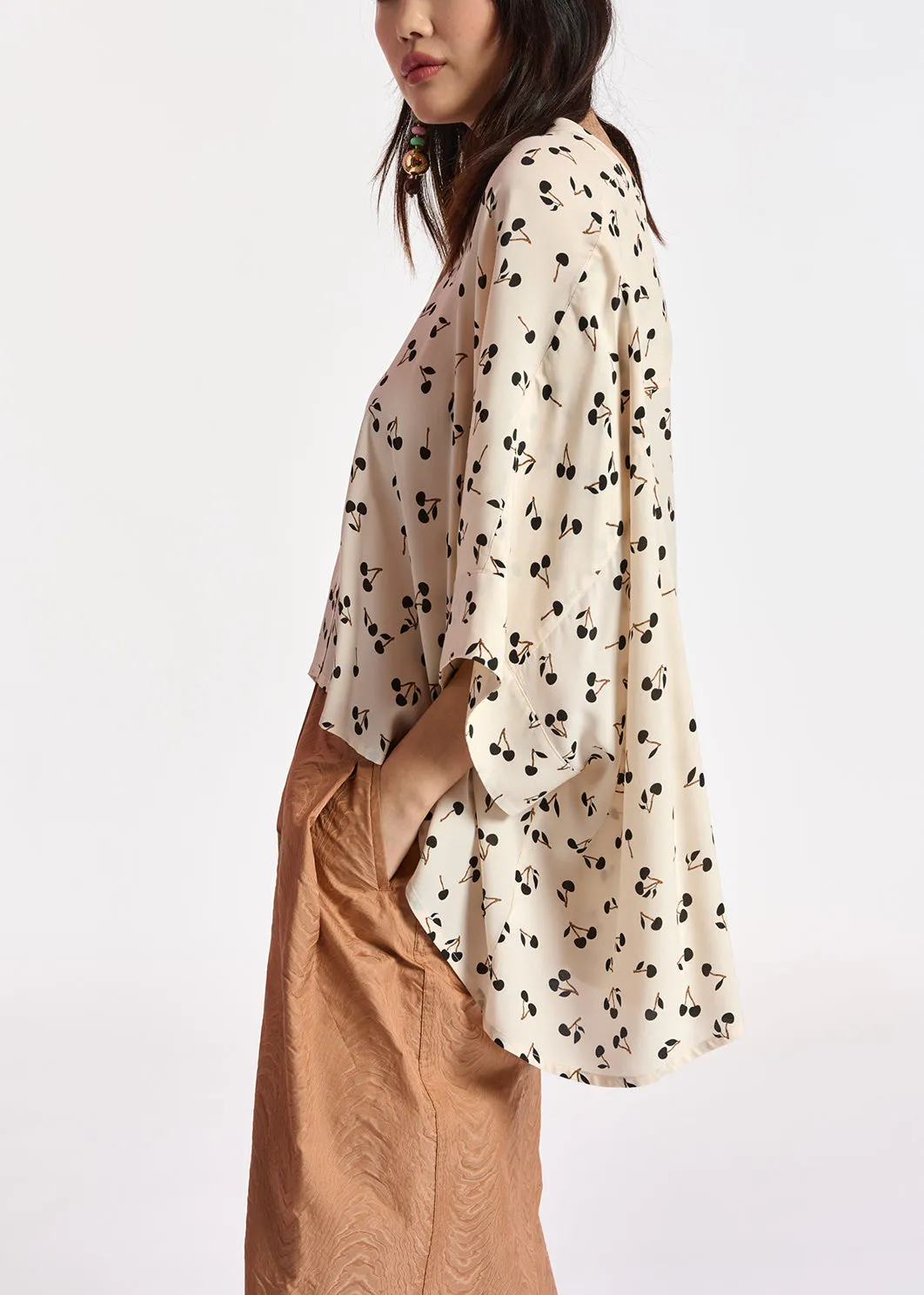 Off-white oversized top with black cherries motif