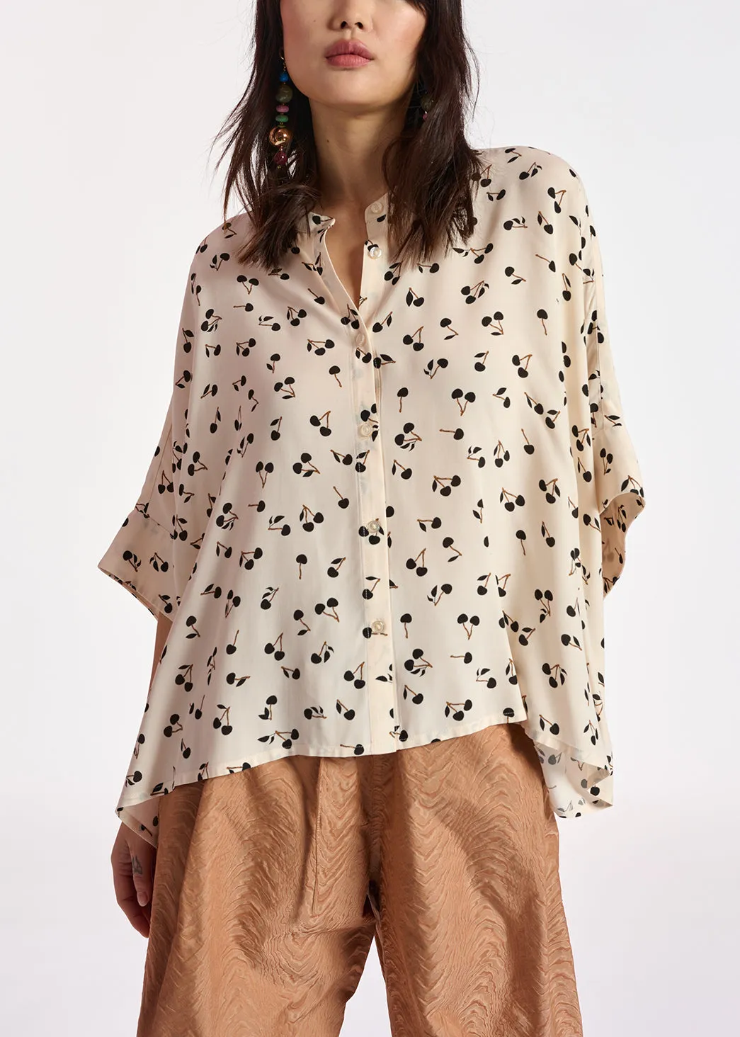 Off-white oversized top with black cherries motif