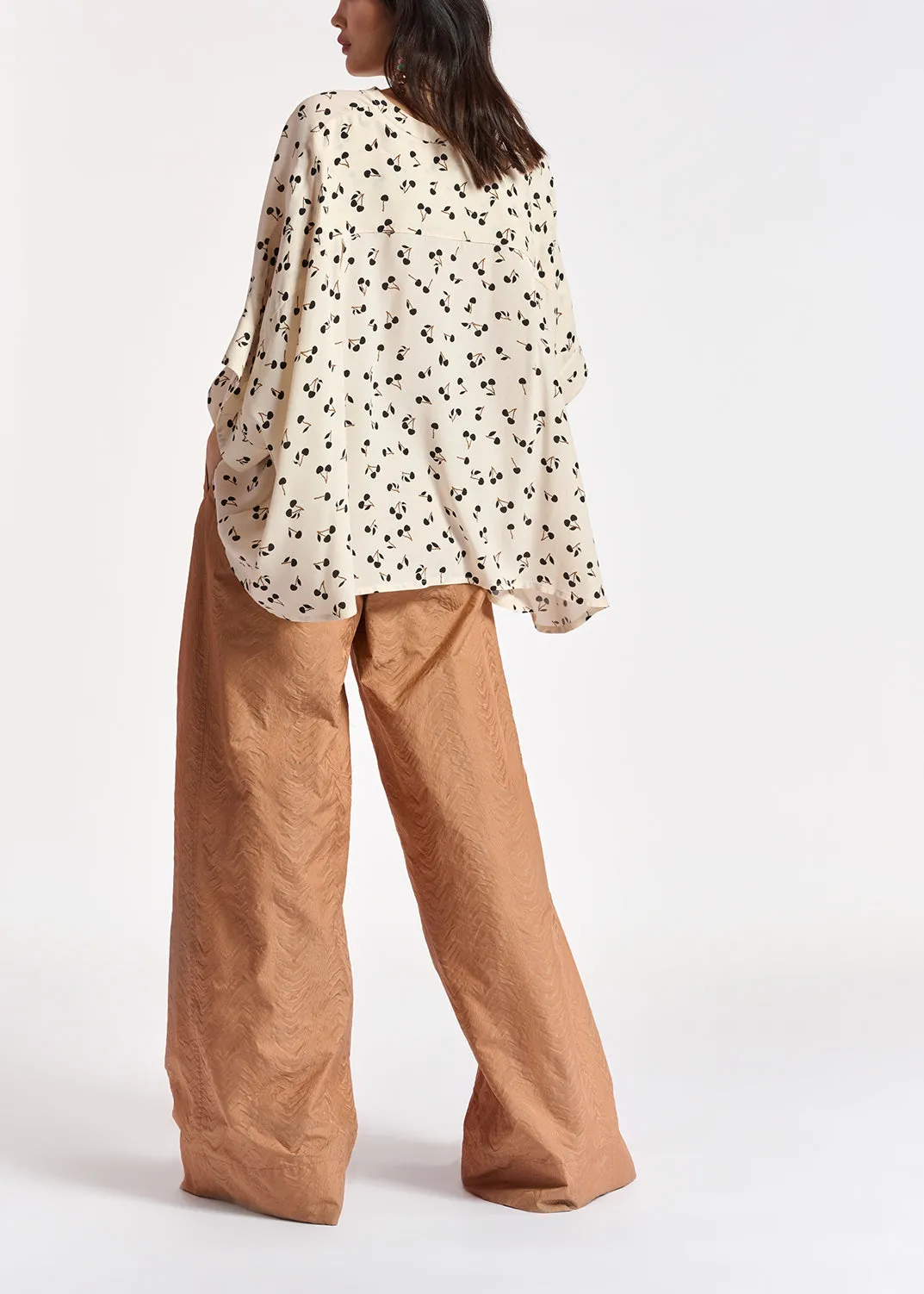 Off-white oversized top with black cherries motif