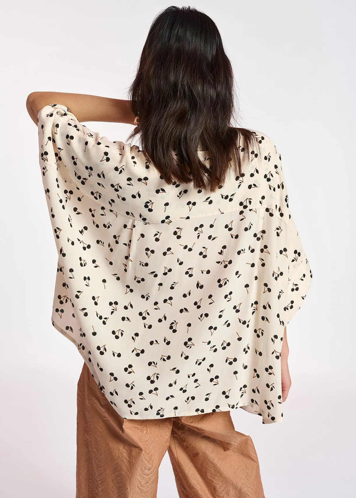 Off-white oversized top with black cherries motif