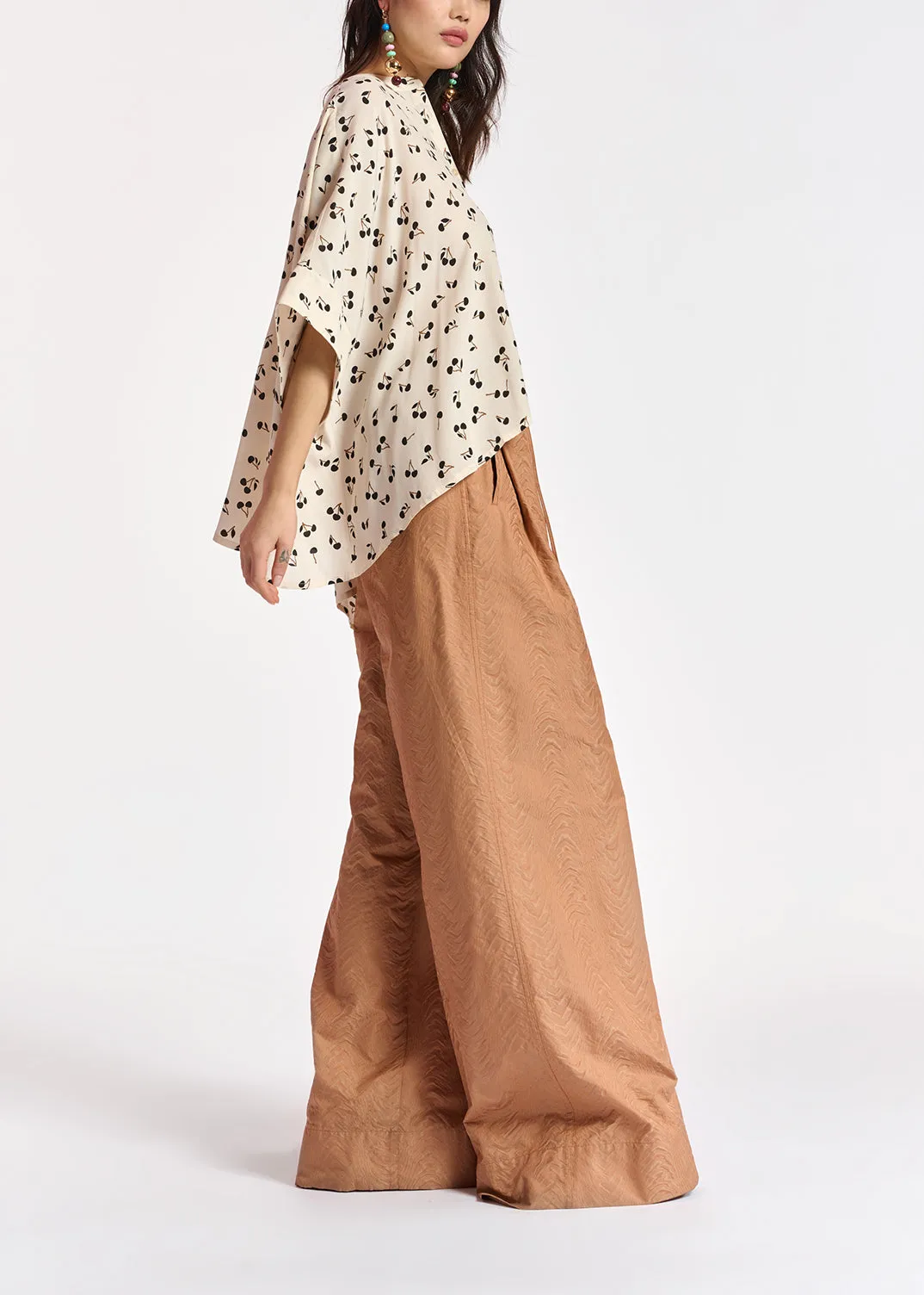 Off-white oversized top with black cherries motif