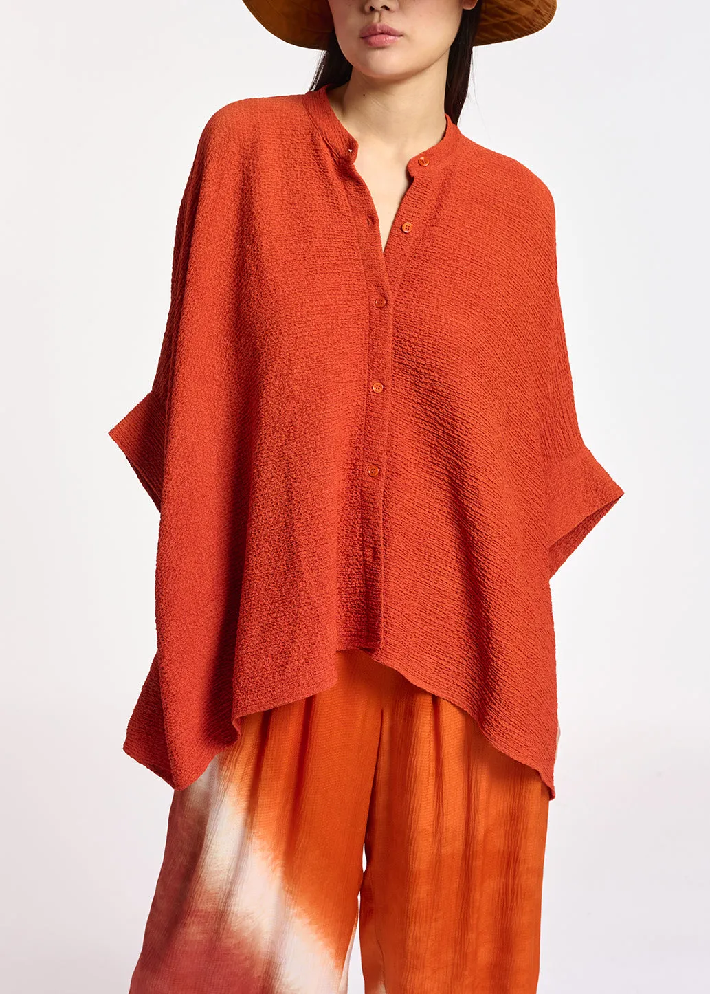 Orange boxy-cut seersucker shirt