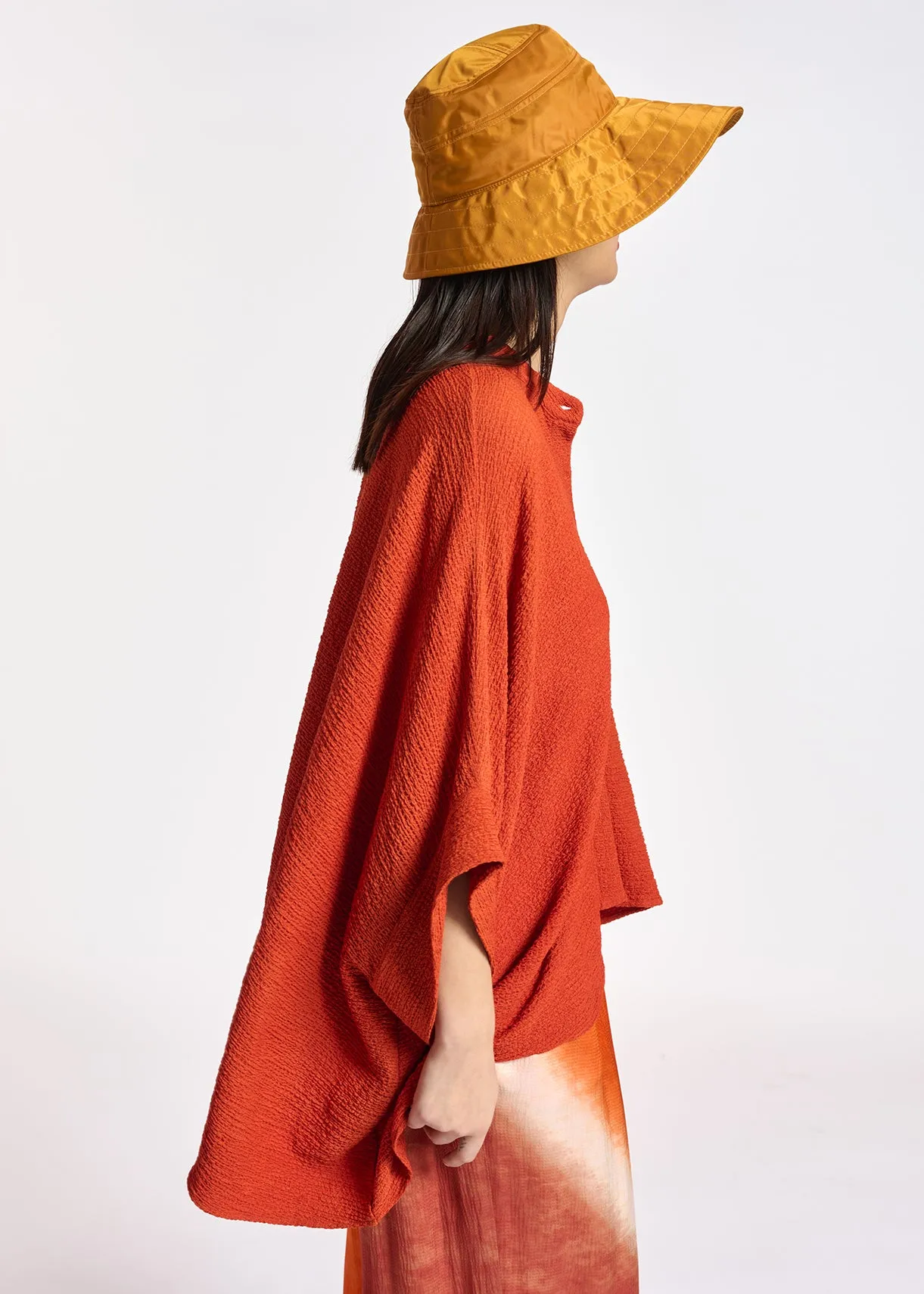 Orange boxy-cut seersucker shirt