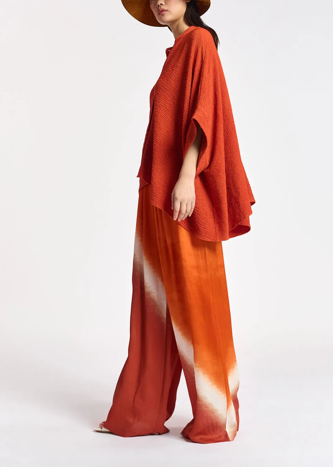 Orange boxy-cut seersucker shirt