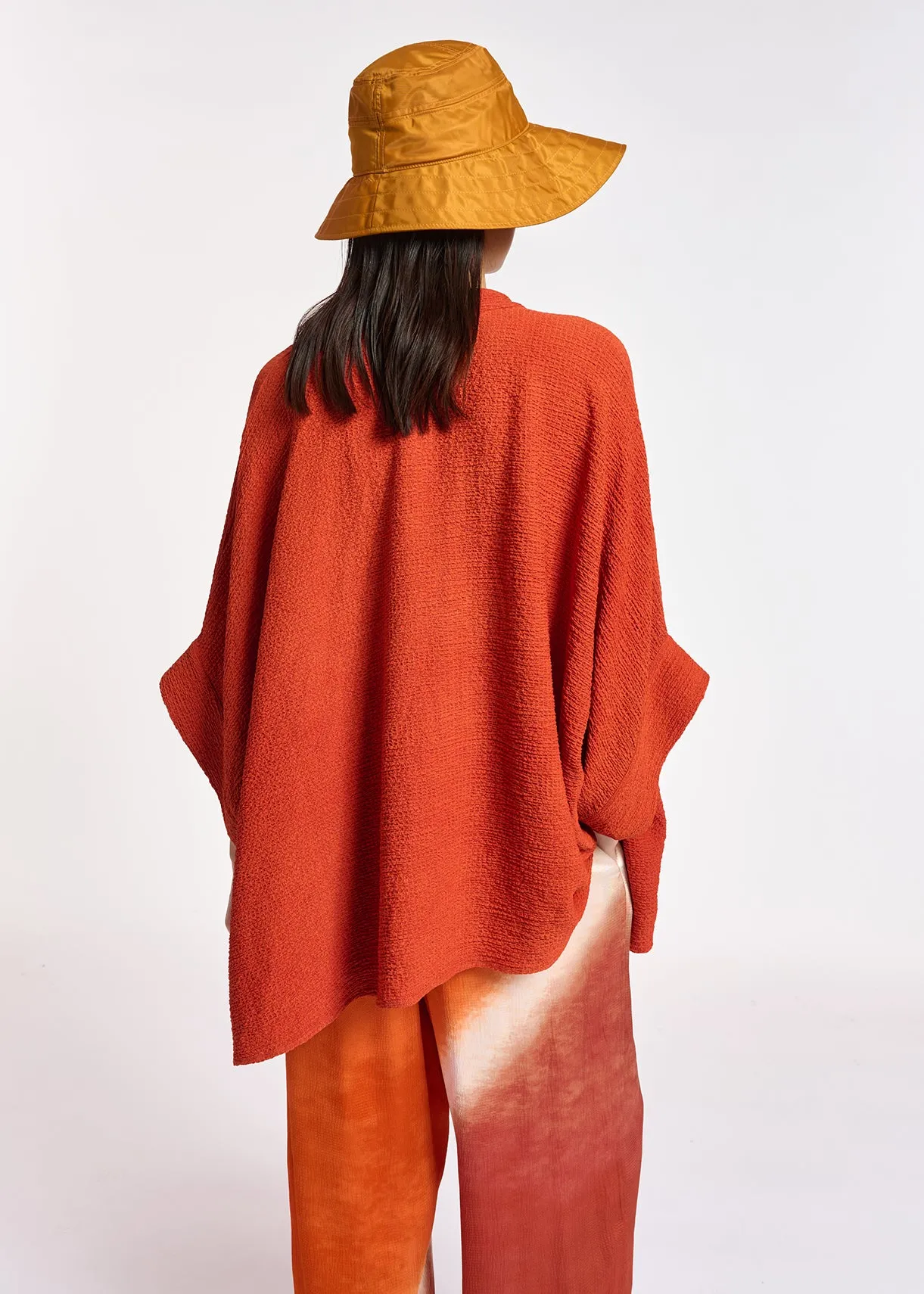 Orange boxy-cut seersucker shirt
