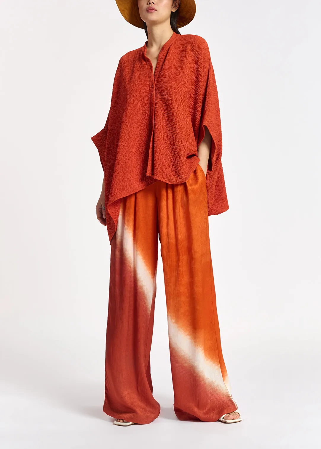 Orange boxy-cut seersucker shirt