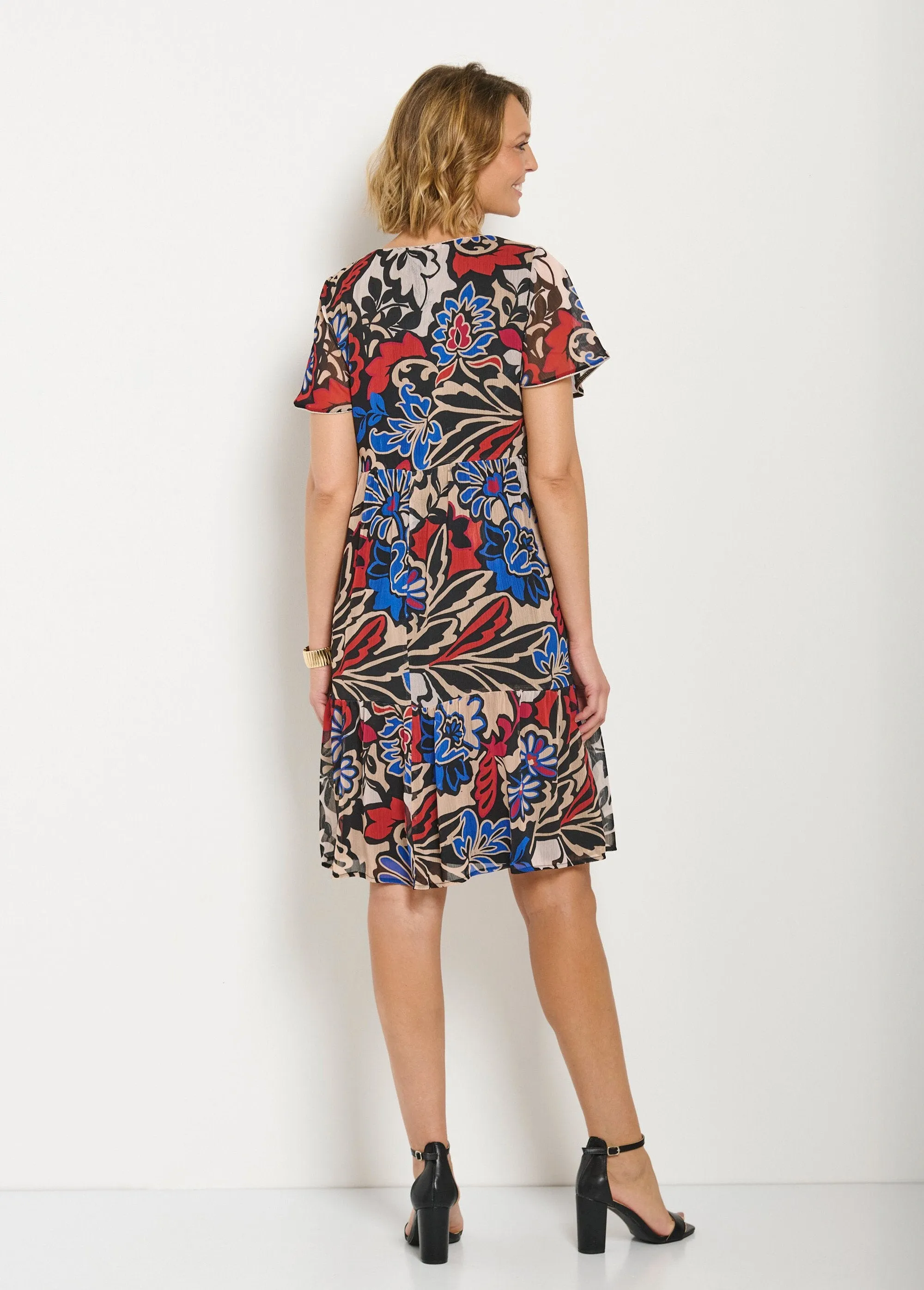 Short flared dress with ruffled printed voile