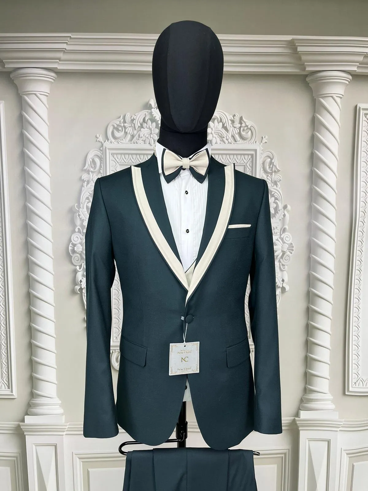 Single Button Three Piece Tuxedo Suit with contrasting black satin lapel, matching bow tie and Black Pants.