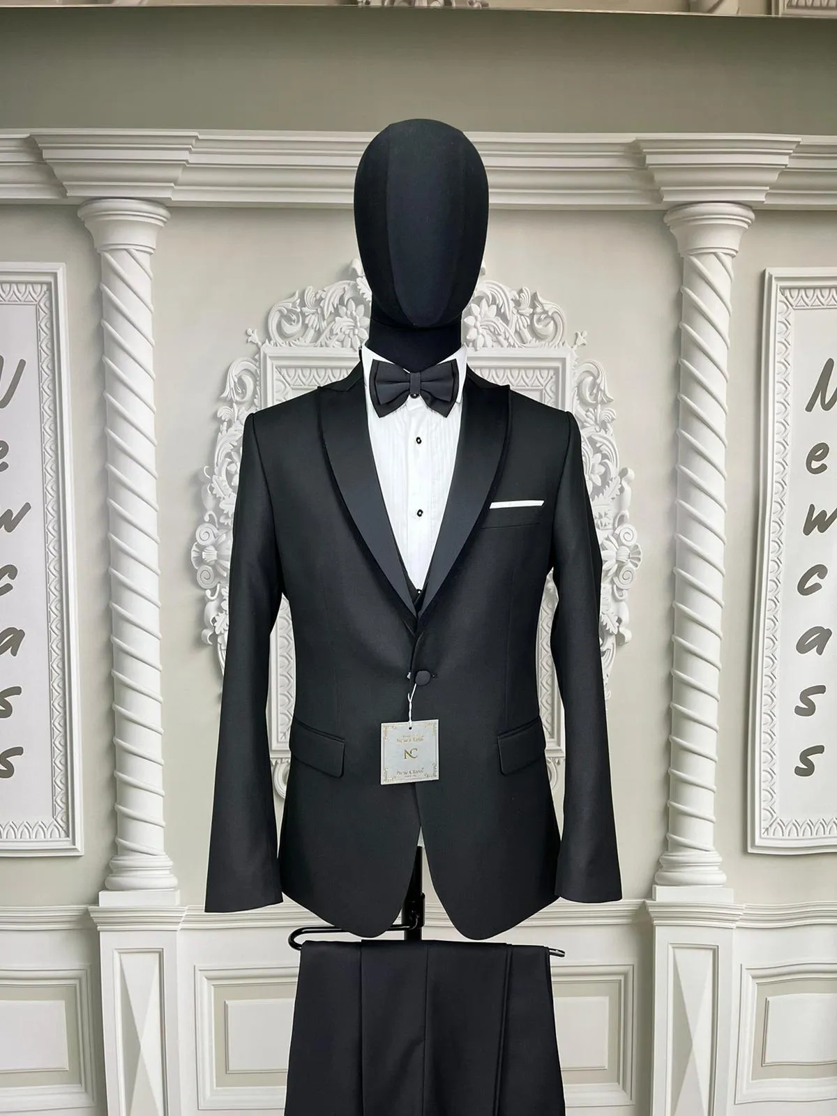 Single Button Three Pieces Tuxedo Suit with Contrasting Black Satin Lapel, matching bow tie and Black Pants.