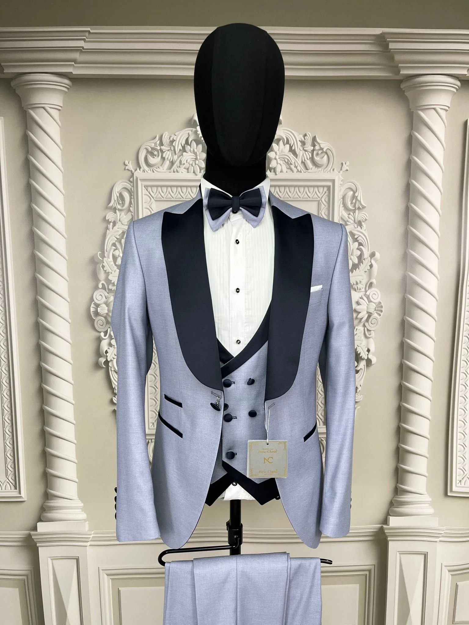 Single Button Three Pieces Tuxedo Suit with contrasting green velvet Lapel, matching bow tie and Black Pants.