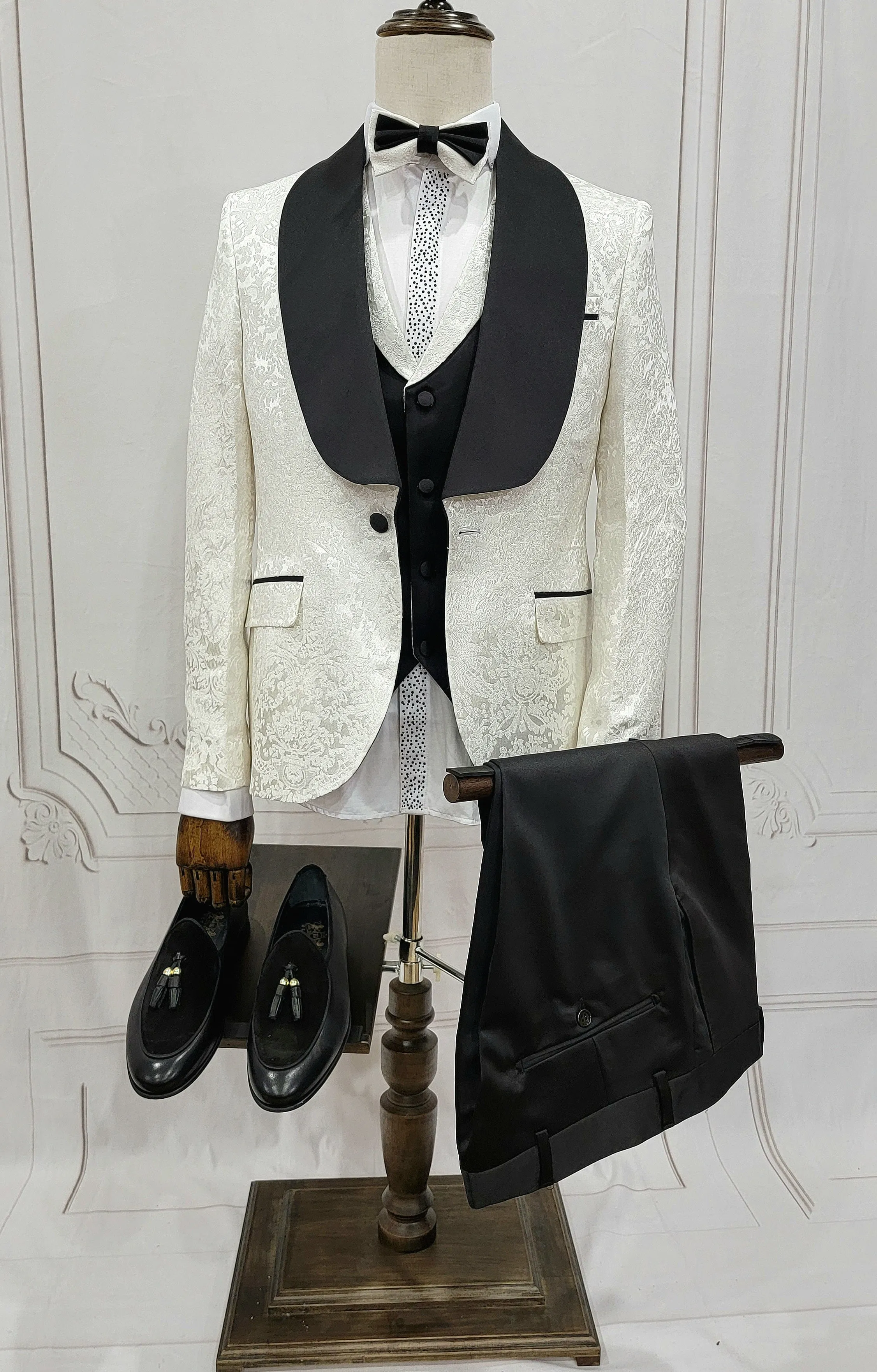 Three Pieces Tuxedo Suit with Contrasting Black Satin Lapel, matching bow tie and Black Pants.
